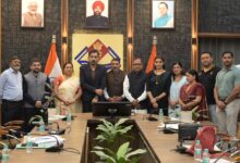 Newly elected members of the District Planning Committee in Dehradun receive their certificates; a call is made to accelerate development work.