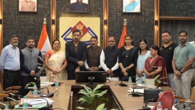 Newly elected members of the District Planning Committee in Dehradun receive their certificates; a call is made to accelerate development work.